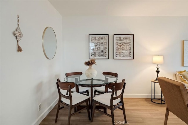 dining room with light hardwood / wood-style floors