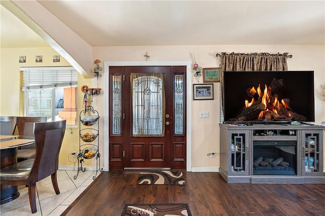 foyer with dark hardwood / wood-style floors