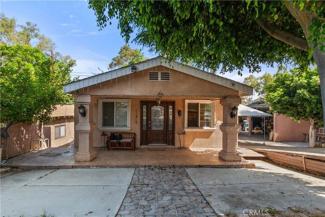 bungalow-style home featuring a patio area