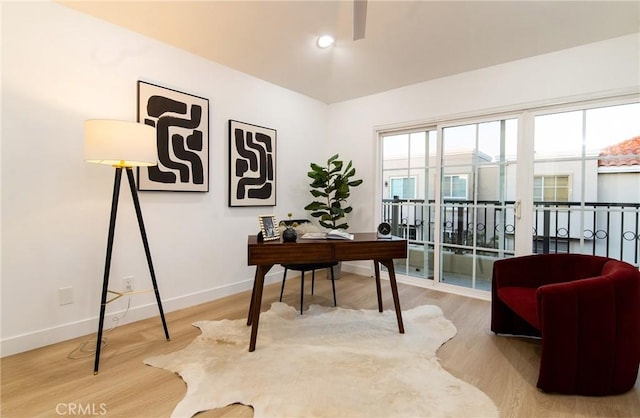 home office with hardwood / wood-style floors