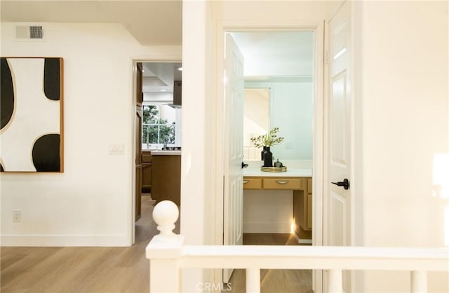 hallway featuring light hardwood / wood-style floors