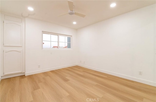 spare room with ceiling fan and light hardwood / wood-style floors