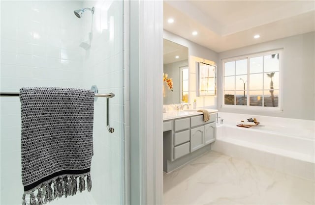 bathroom featuring vanity and plus walk in shower