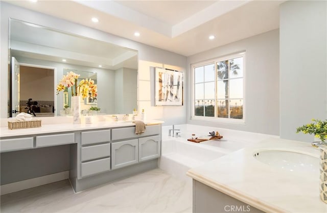 bathroom featuring vanity and a bathing tub