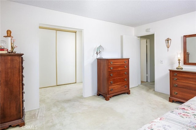 carpeted bedroom with a closet