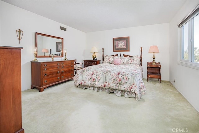 bedroom with light colored carpet