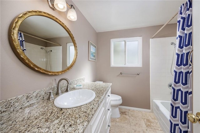 full bathroom featuring vanity, toilet, and shower / tub combo