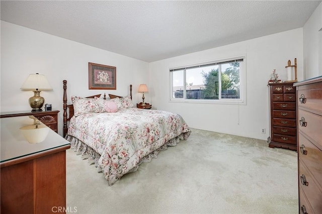 carpeted bedroom with a textured ceiling