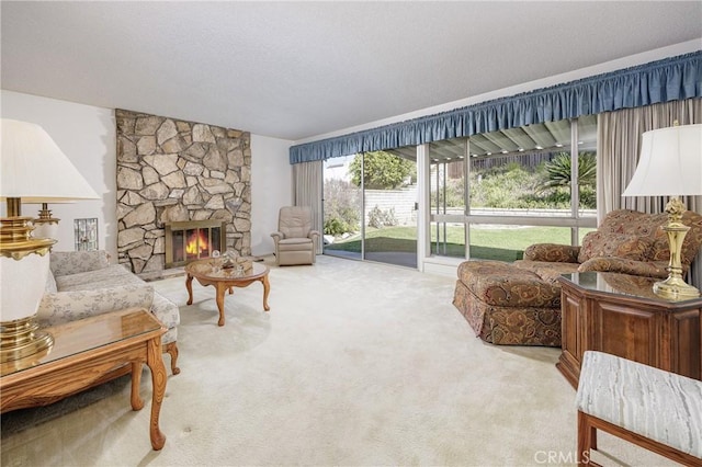 living room with a stone fireplace and light carpet