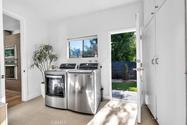 washroom with separate washer and dryer