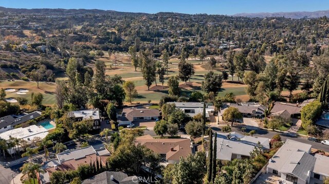 birds eye view of property with a mountain view