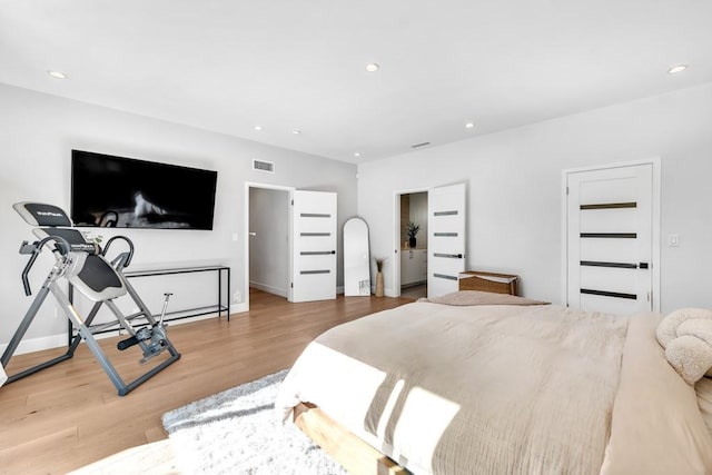 bedroom with light hardwood / wood-style floors