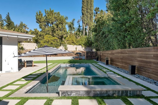 view of swimming pool with a patio and an in ground hot tub