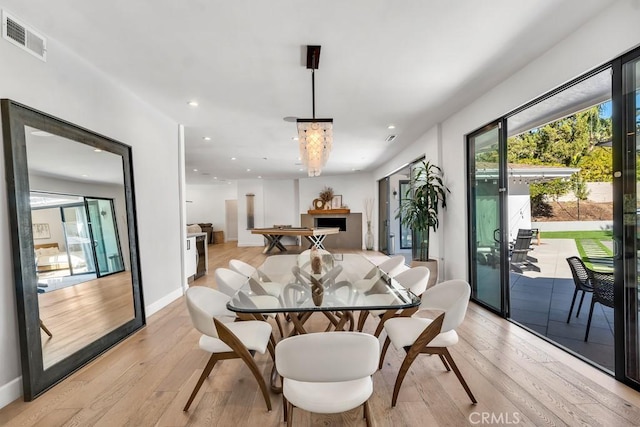 dining area with light hardwood / wood-style flooring