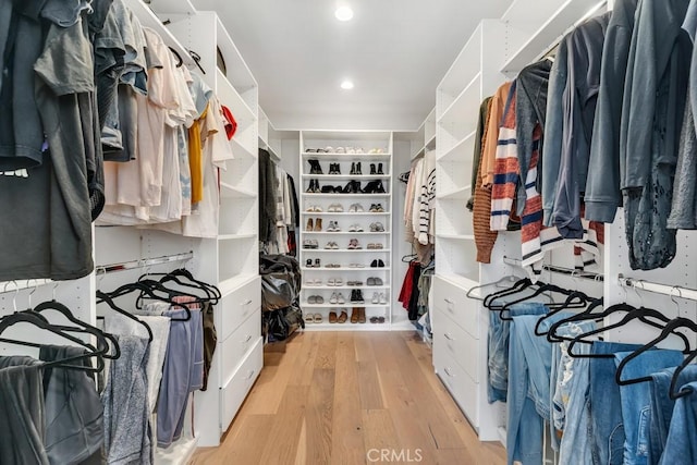 spacious closet featuring light hardwood / wood-style floors