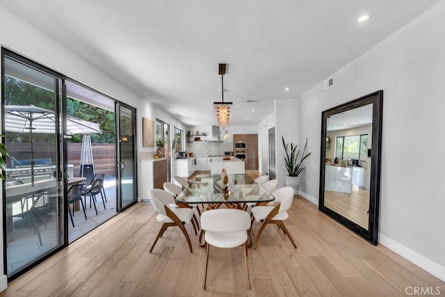 dining room with light hardwood / wood-style floors