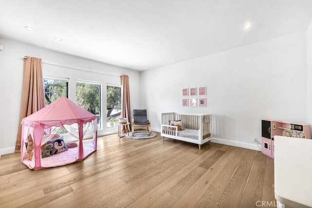 living area with hardwood / wood-style floors