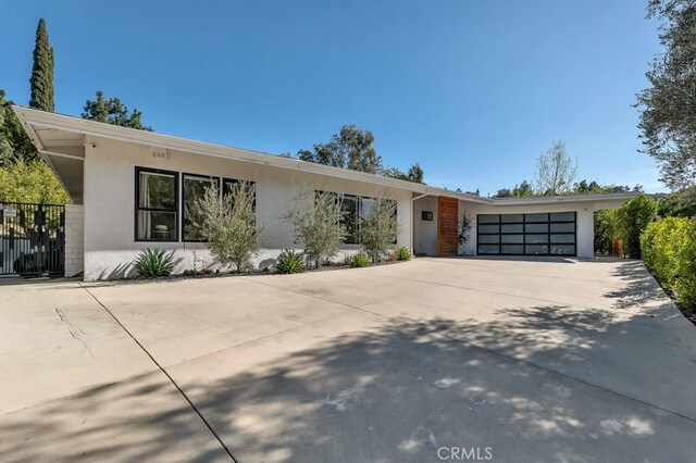 single story home featuring a garage