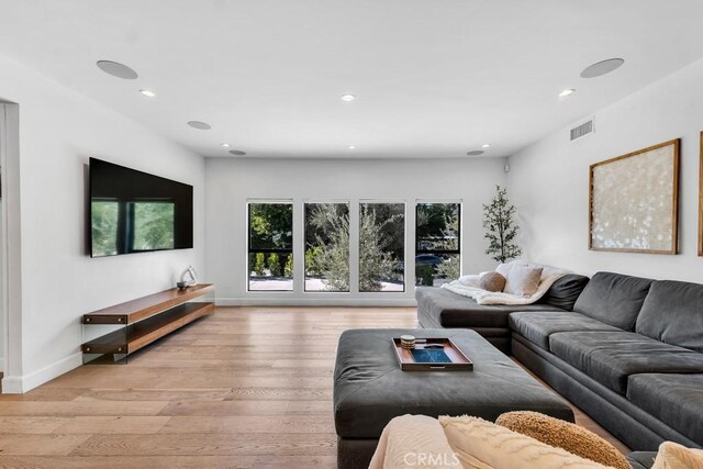 living room with light hardwood / wood-style floors