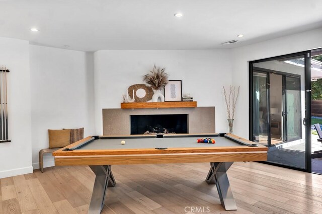 recreation room with billiards and light wood-type flooring