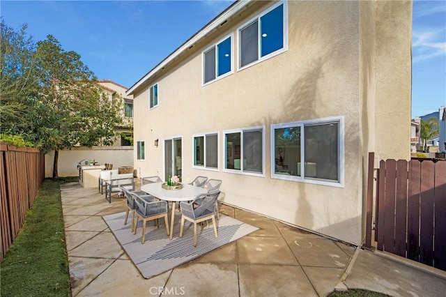 back of house with a patio area