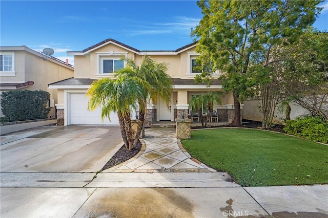 view of front of house with a garage and a front lawn