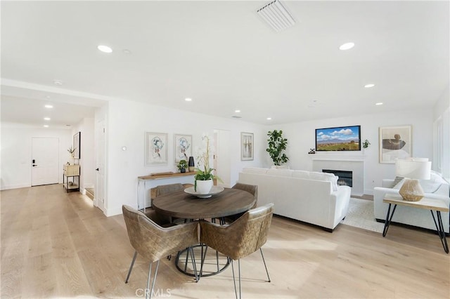 dining room with light hardwood / wood-style floors