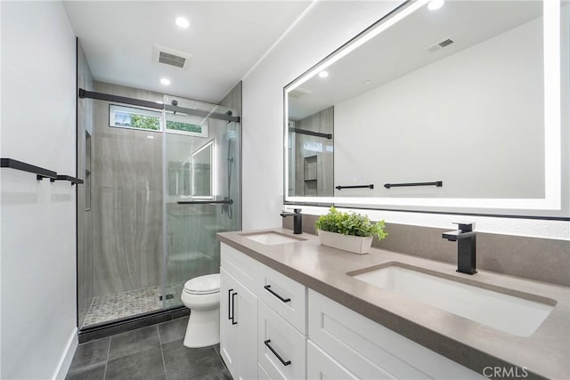 bathroom with vanity, an enclosed shower, tile patterned flooring, and toilet