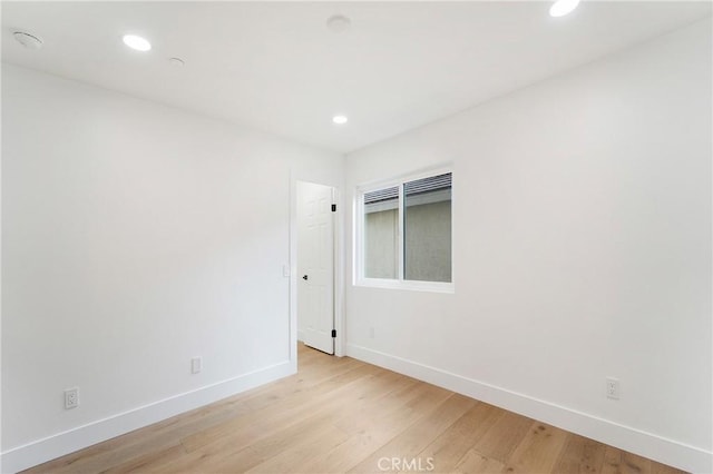 spare room featuring light wood-type flooring