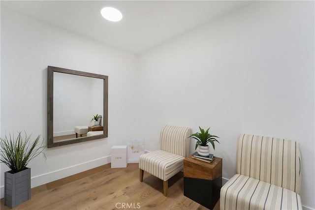 sitting room featuring light hardwood / wood-style floors