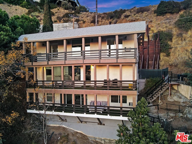 view of outdoor building at dusk