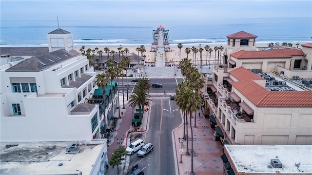 birds eye view of property featuring a water view and a view of the beach