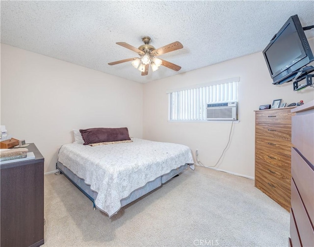 carpeted bedroom featuring cooling unit, ceiling fan, and a textured ceiling