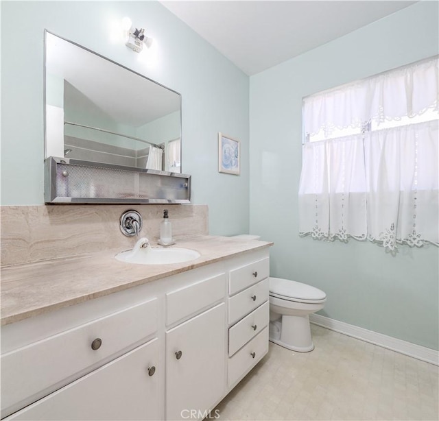 bathroom with vanity, toilet, and a shower with curtain