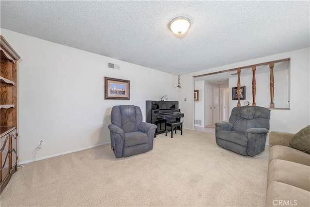 living room with light carpet and a textured ceiling