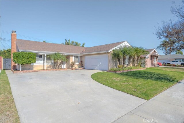 ranch-style house with a garage and a front lawn