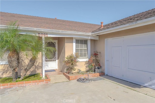 view of exterior entry featuring a patio