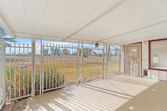 unfurnished sunroom featuring plenty of natural light