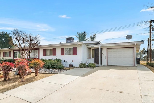 ranch-style home featuring a garage