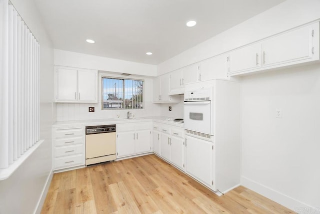 26405 Cherry Hills Blvd, Menifee, CA 92586 - kitchen featuring white appliances, light countertops, white cabinets, light wood-type flooring, and baseboards