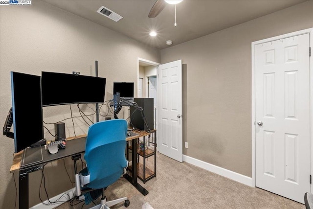 office area featuring light colored carpet and ceiling fan