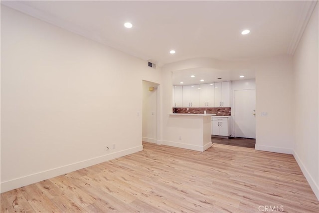 unfurnished living room featuring light hardwood / wood-style floors