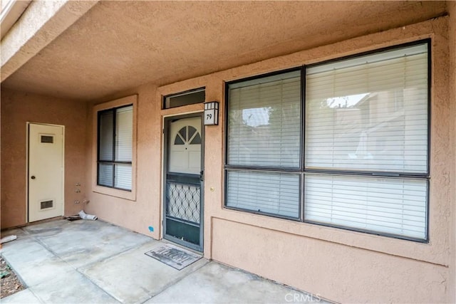 entrance to property with a patio area