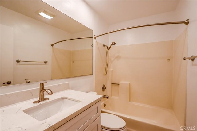 full bathroom with vanity, bathtub / shower combination, and toilet