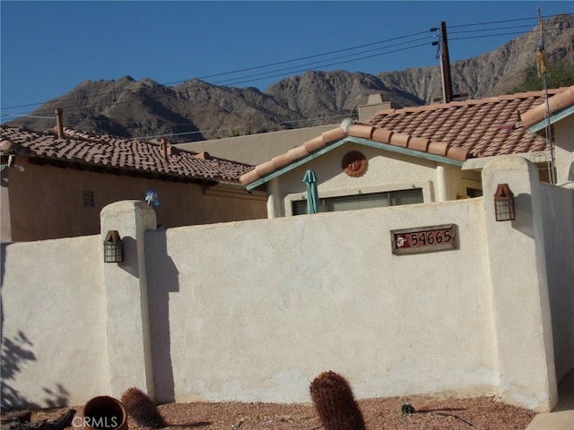 view of property exterior featuring a mountain view