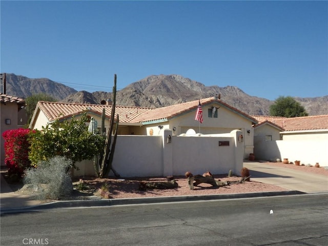 mediterranean / spanish-style house featuring a mountain view