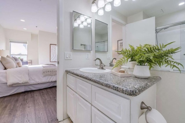 bathroom featuring vanity and hardwood / wood-style flooring