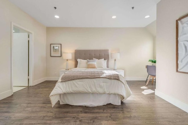 bedroom with hardwood / wood-style flooring