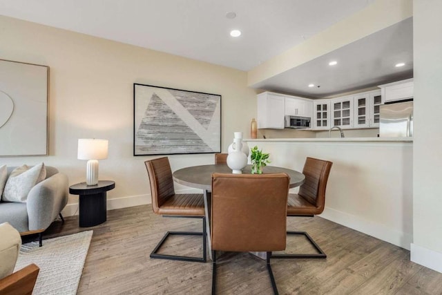 dining space featuring light hardwood / wood-style flooring