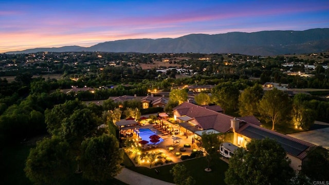 aerial view at dusk with a mountain view